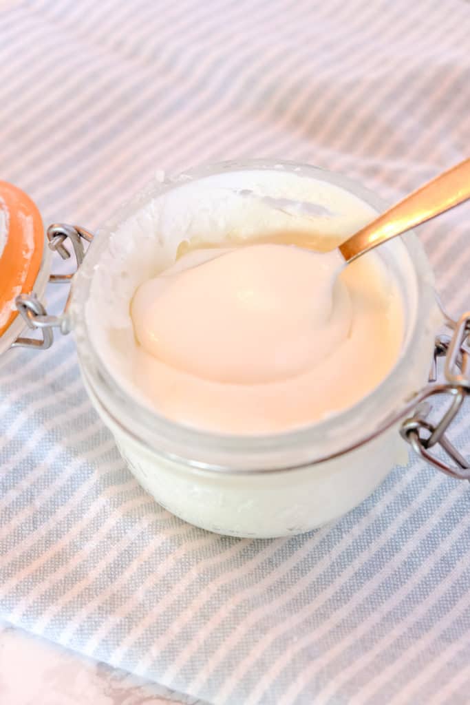 smooth clotted cream in a glass jar