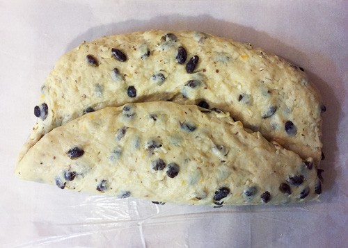 Bottom third of the dough folded to cover the raisins in the center