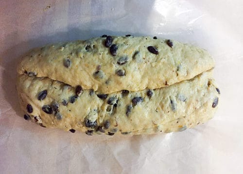 1/3 of the dough folded to cover the raisins in the middle