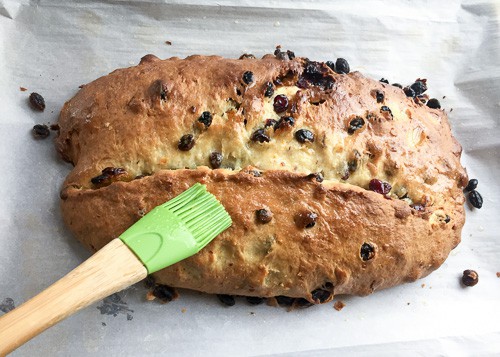 Melted butter brushed over the Stollen bread after baking