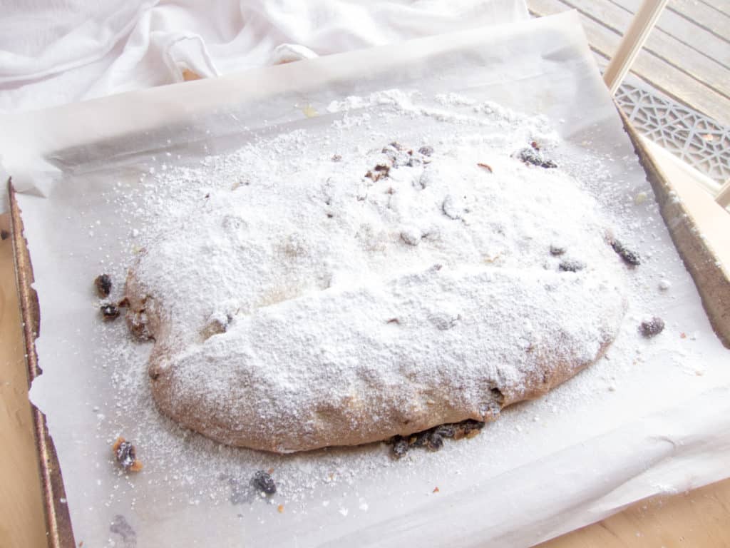 Stollen bread covered with sifted powdered sugar