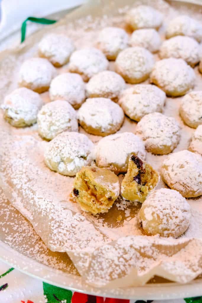 Stollen bites with raisins, candied zest, almonds, and powdered sugar