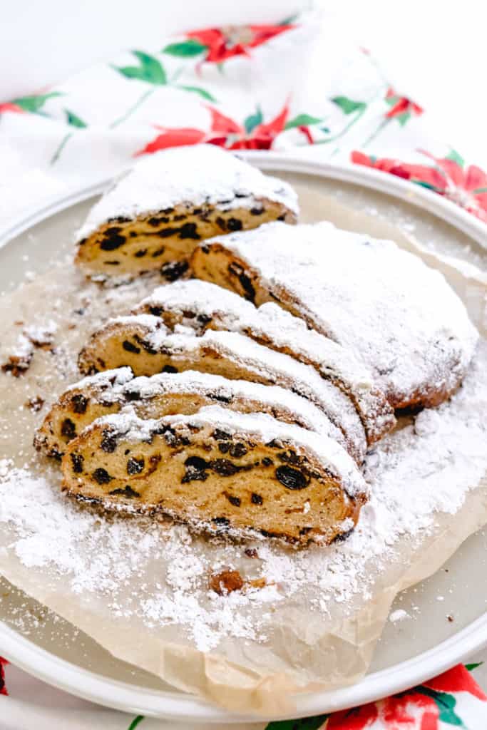 slices of Stollen with raisins, candied zest, almonds, and powdered sugar