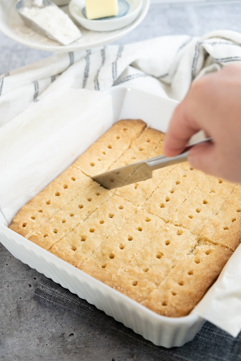 cutting dough along scored lines