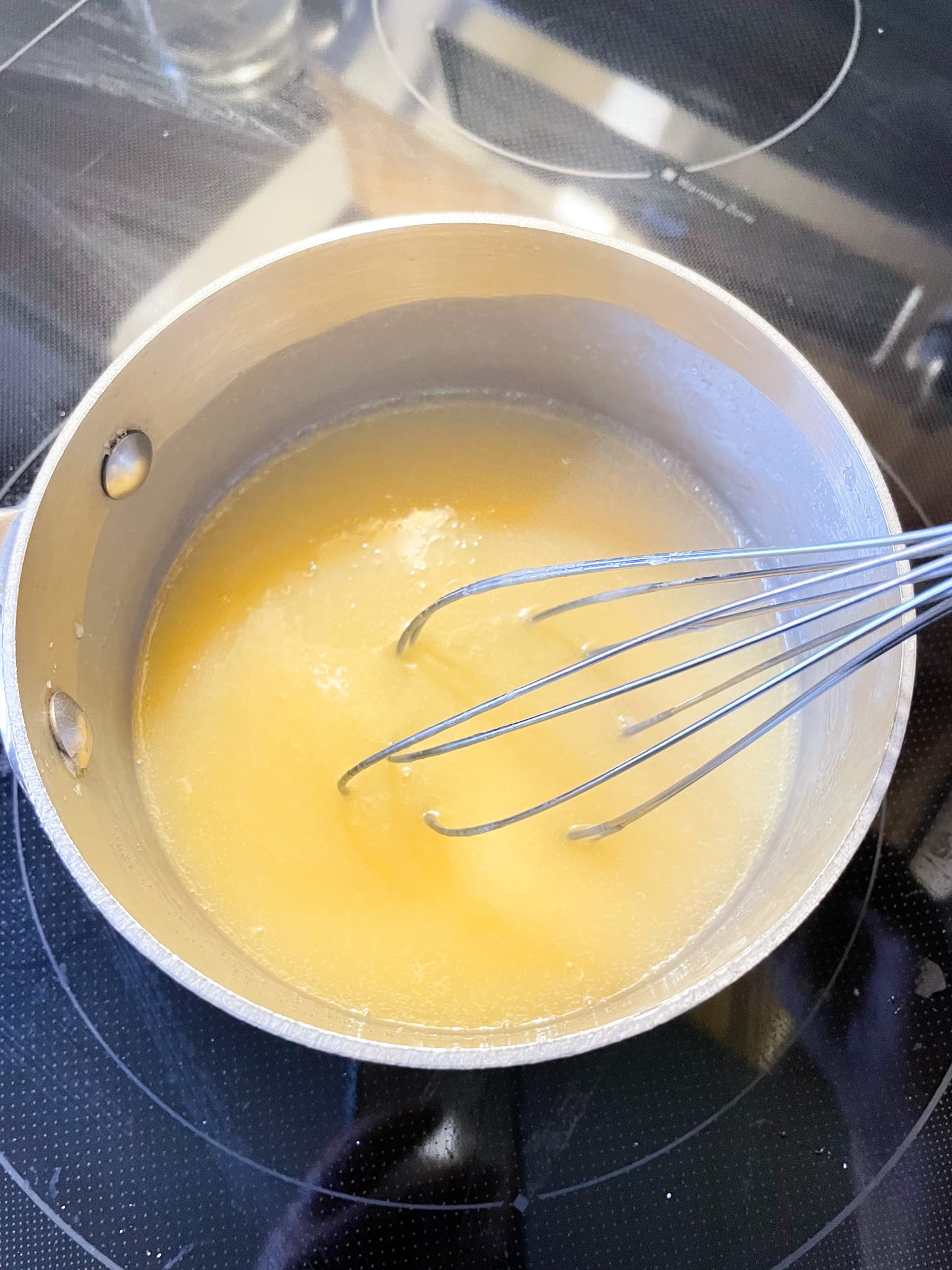 stirring ingredients in saucepan