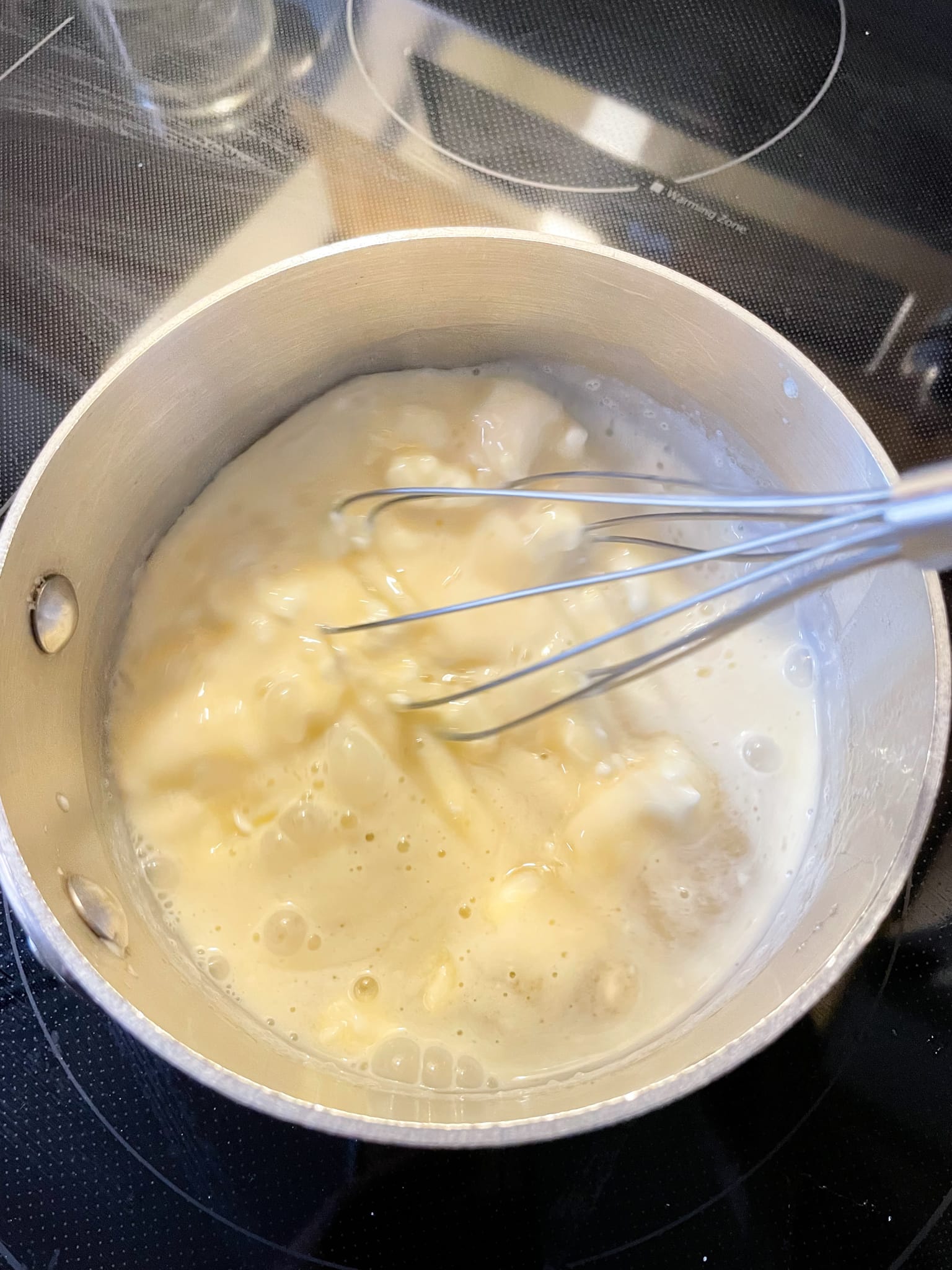 stirring ingredients in saucepan