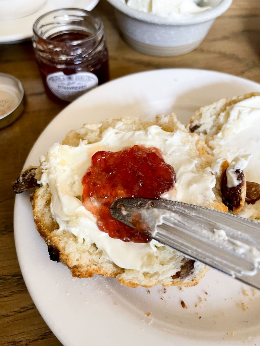 scone with clotted ream and strawberry jam